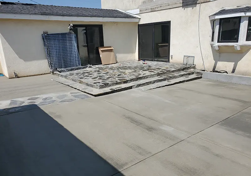 Flagstone patio and concrete driveway