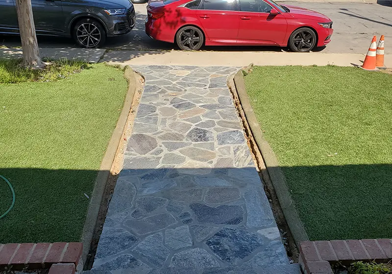 Flagstone walkway to home’s entrance